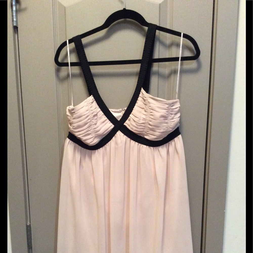 Pale pink dress with beaded detail.